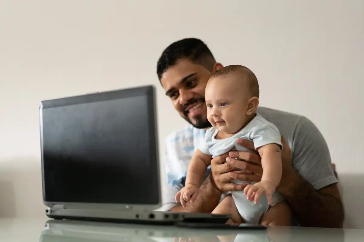 Father and child looking at screen